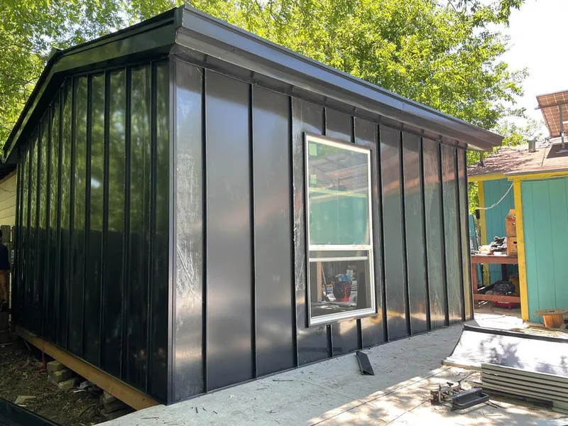 Black standing seam metal wall panels for Metal Roof Installation in Belding