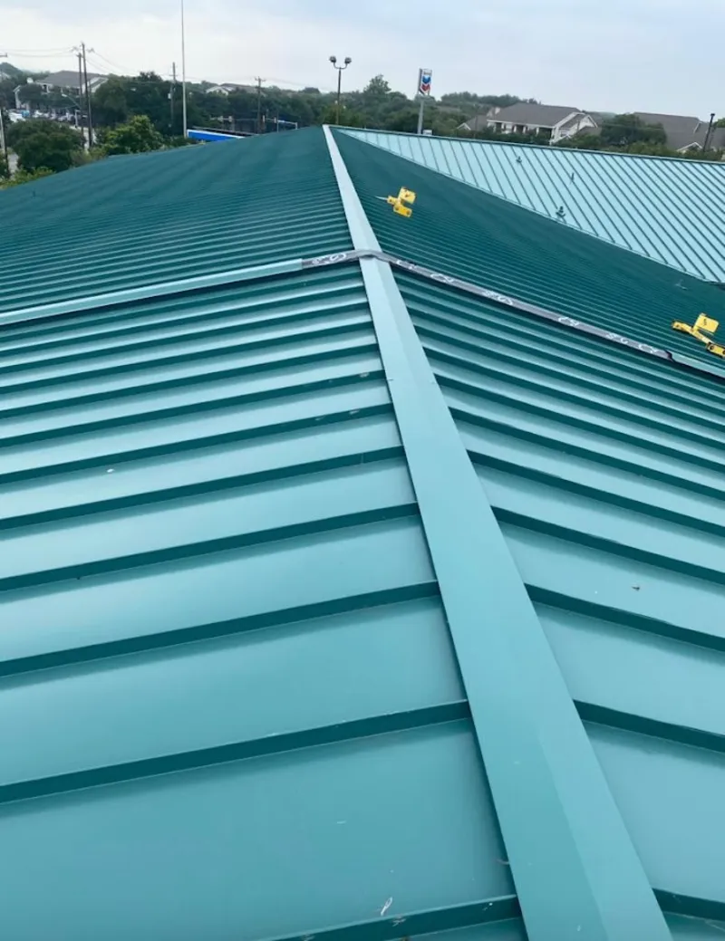 Green commercial metal roof ridge and valley for Metal Roof Repair in Belding